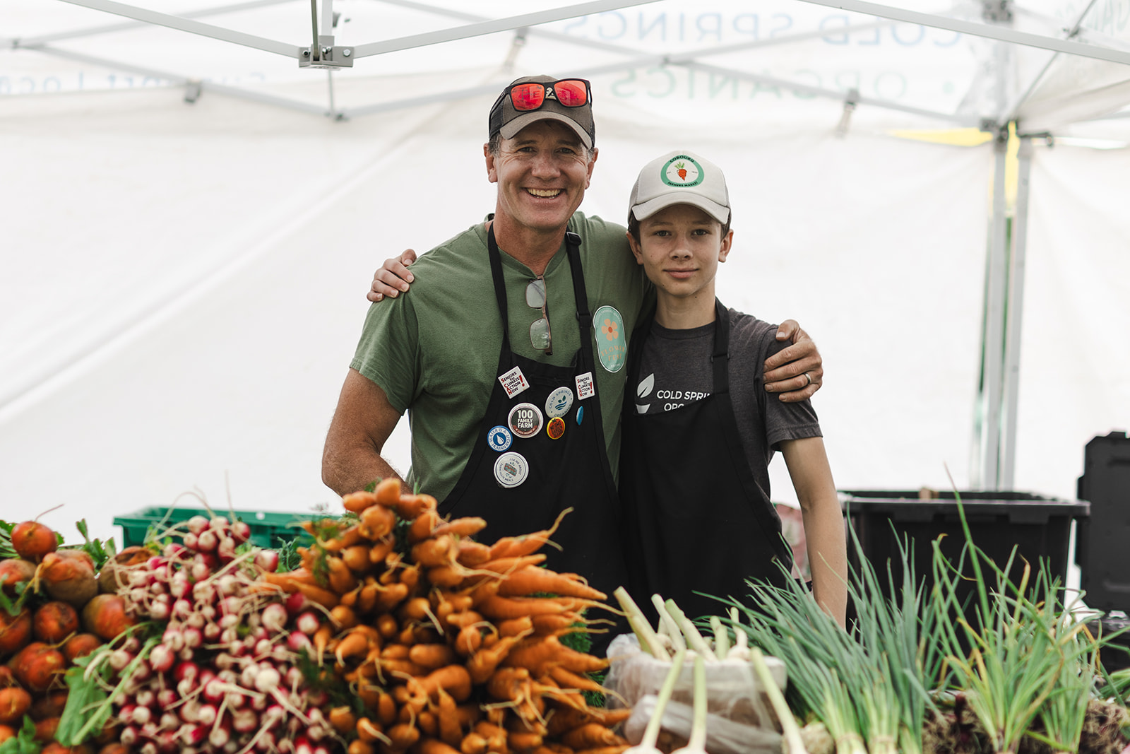 Cold Springs Organics growers at their market stand