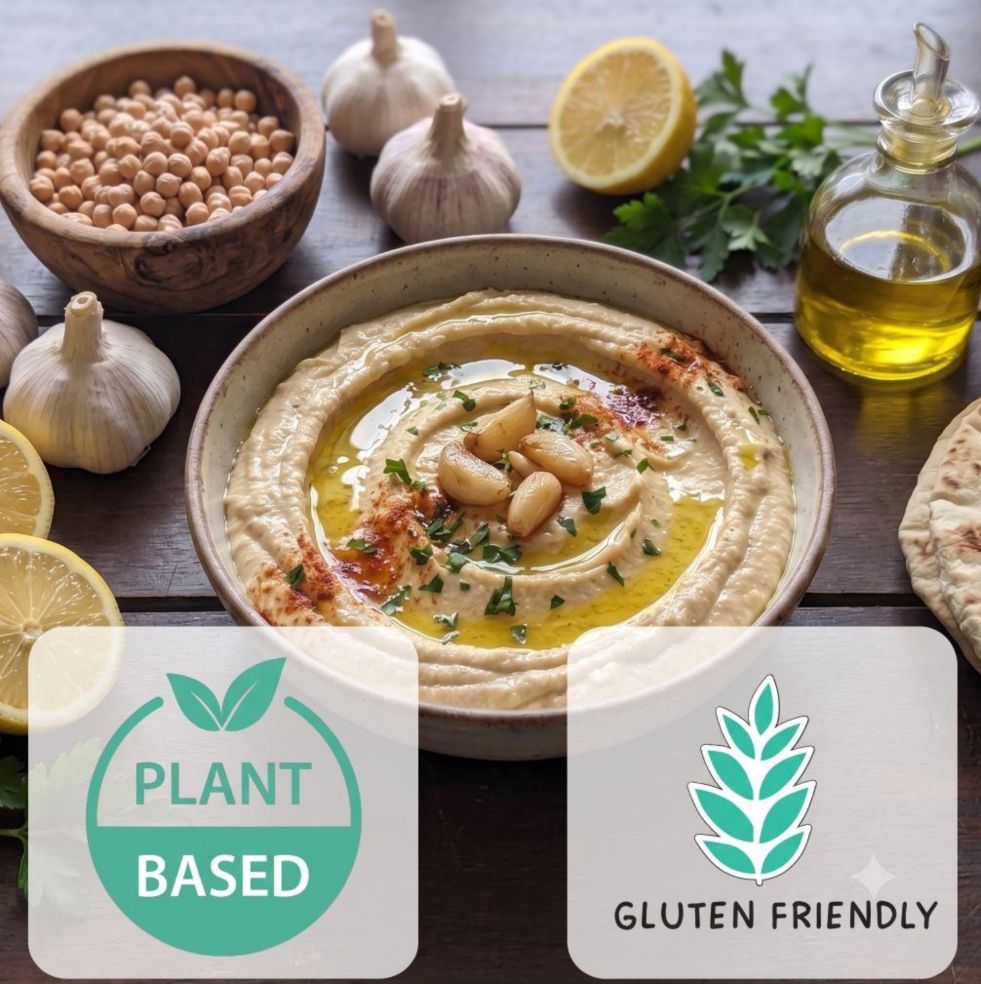 A bowl of hummus with chickpeas, garlic and olive oil